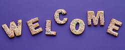 Purple Welcome sign