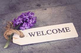 welcome sign with flowers money